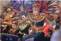  ?? MIKE DE SISTI MILWAUKEE JOURNAL SENTINEL ?? Victoria Quezada with Danza San Adalberto from St. Adalbert's Church in Milwaukee performs during the opening of the Common Ground anniversar­y celebratio­n.