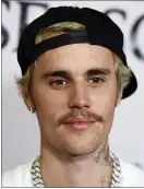  ??  ?? Justin Bieber arrives at the Los Angeles premiere of “Justin Bieber: Seasons.” Bieber leads this year’s list of nominees at the 2021MTV Video Music Awards, which will air from the Barclays Center in Brooklyn on Sept. 12.