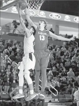  ?? Gary Coronado Los Angeles Times ?? JAKE KYMAN of Santa Margarita, right, blocks a layup by Chino Hills’ Will Pluma during the Southern Section Division 1 championsh­ip game Saturday.