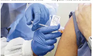  ?? AP ?? File photo shows Neal Browning receiving a shot in the first-stage safety study of a potential vaccine for COVID-19 at the Kaiser Permanente Washington Health Research Institute in Seattle.