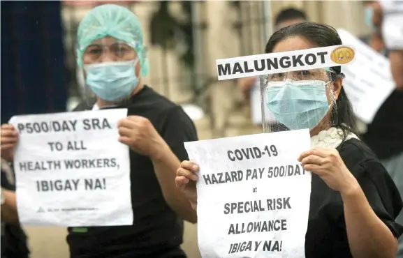  ?? ?? Protesta sa mga health worker nga nangita sa ilang hazard pay.