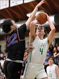  ?? PHOTO BY MICHAEL OWEN BAKER ?? Thousand Oaks' Elias Chin, right, is fouled by Westlake's Danny Bao during Friday night's Marmonte League game. The Lancers won 72-59.