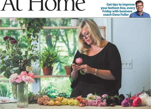  ?? CITIZEN NEWS SERVICE PHOTO BY JENNIFER HEFFNER ?? Holly Chapple lays out and inspects each flower that goes into a bridal bouquet, while working in May in her floral design studio in Loudoun County, Virginia.