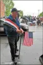 ??  ?? Grand marshal J. Thomas Burtnick, a Lansingbur­gh native and U.S. Navy veteran, in the Veterans of Lansingbur­gh 21st annual Memorial Day Parade.