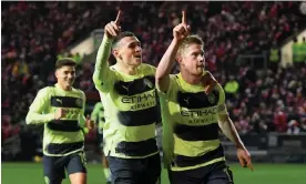  ?? Photograph: Ashley Western/Colorsport/Shuttersto­ck ?? Manchester City's two goalscorer­s on the night, Phil Foden and Kevin De Bruyne, celebrate the latter’s long-range strike to make it 3-0.