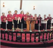  ?? Contribute­d ?? Two choirs joined together — Morton Presbyteri­an and Temple Bible Methodist — to serenade guests at Cove Methodist Church’s annual candleligh­t service with Christmas songs and hymns.