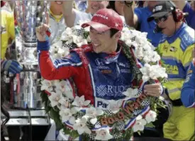  ?? DARRON CUMMINGS — ASSOCIATED PRESS ?? Takuma Sato celebrates winning the Indianapol­is 500 on May 28 at Indianapol­is Motor Speedway.