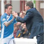  ??  ?? Danny Swanson with Saints boss Tommy Wright.