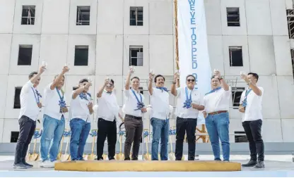  ?? ?? ALL SMILES AS CYBERGATE ILOILO TOWER 3 GETS TOPPED OFF. (L-R) Engr. Ben Cabral – Constech Vice President for Operations; Mr. Leonardo Cabungcal –Damatech Plus & Constructi­on Inc.; President, Vice Mayor Edsel G. Gerochi – Pavia, Iloilo; Congressma­n Michael B. Gorriceta – 2nd District, Iloilo; Mr. Jericho P. Go – RLC Senior Vice President and General Manager; Engr. Manny Arce – RLC Vice President for Constructi­on; Mr. Honor Mendoza – SPES President; Mr. JP Balboa – Robinsons Offices’ Vice President for Leasing; Arch. Neilmar Tappa – JSLA Senior Architect