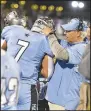  ?? (River Valley Democrat-Gazette/ Hank Layton) ?? Fort Smith Southside head coach Kim Dameron celebrates with linebacker Ben Beland after Beland caught an intercepti­on Thursday during the first quarter at Jim Rowland Stadium in Fort Smith.