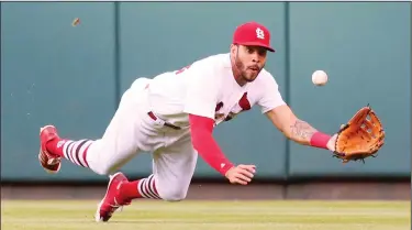  ?? CHRIS LEE/TRIBUNE NEWS SERVICE ?? St. Louis Cardinals center fielder Tommy Pham dives to catch a line drive by the Pittsbugh Pirates' Jordy Mercer to end the top of the second inning on Friday in St. Louis.