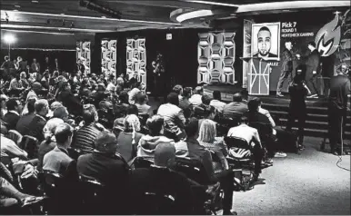  ?? FRANK FRANKLIN II/AP ?? Spectators watch the NBA 2K League esports draft in New York. The league launches in May with the best “NBA 2K” players.