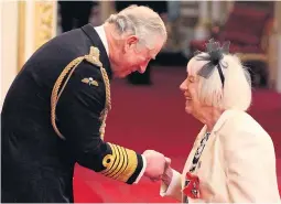  ?? Pictures: ALVARO DIAZ & YUI MOK/PA ?? Pamela Butcher receiving her MBE from Prince Charles yesterday