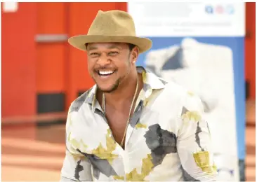  ?? (Pine Bluff Commercial/I.C. Murrell) ?? Actor Pooch Hall smiles upon his entrance into Pine Bluff High School’s McFadden Gymnasium to talk with students during an Arkansas Martin Luther King Jr. Nonviolenc­e Youth Summit on Friday.