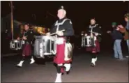  ?? DFM FILE PHOTO ?? A standard feature of the AOH Veterans Day observance is a performanc­e by the Irish Thunder Pipes and Drums march, as seen here in a file photo.