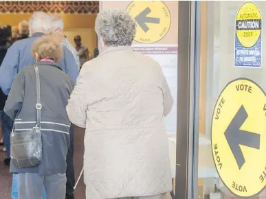  ?? BOB TYMCZYSZYN/ST. CATHARINES STANDARD/POSTMEDIA NETWORK ?? Residents were lined up as advance polls opened up at noon Friday. If turnout rose to 66 per cent — the highest since 1997 — that would still mean one in three voters didn’t travel to the ballot box.