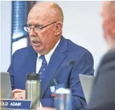  ?? TOM TINGLE/THE REPUBLIC ?? Harold Adair, industry member of the Arizona State Board of Funeral Directors and Embalmers, listens as Franklin Lambert, owner of Family Burial and Cremation in Mesa, appears before the Board Tuesday in Phoenix.