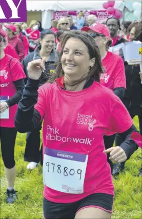  ??  ?? Emma does the warm up before the first Kent Breast Cancer Care Pink Ribbonwalk at Leeds Castle last weekend