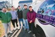  ?? Brian A. Pounds/ Hearst Connecticu­t Media ?? From left, recent graduates of Foran High School in Milford Dilahn Isaku, Shawn Gaul, Alex Moreno, Travis Gentley, and Tyler Borer have launched their newest business, Junk Gone, in Milford.