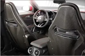  ??  ?? The front seatbacks of the Quadrifogl­io model are made of carbon fibre, suggesting supercar performanc­e from a four-door family sedan.