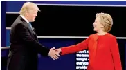  ?? — AP ?? Republican presidenti­al nominee Donald Trump and Democratic rival Hillary Clinton shake hands during the presidenti­al debate at Hempstead, New York, on Monday.