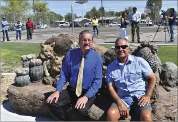  ??  ?? Oakley Elementary School Principal Craig Casey and former Brawley Parks and Recreation Director Richard Rubio relax on the new bobcat family bench at the grand opening of Alyce Gereaux Park. DAN EVERS PHOTOS