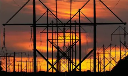  ?? Photograph: Robert F Bukaty/AP ?? Towers supporting electricit­y lines are seen in a power corridor in Brunswick, Maine. Voters in the state rejected replacing private utilities with a non-profit.