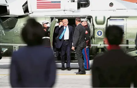  ??  ?? Happy trails: Trump saluting while arriving to board Air Force One as he returns to the United States from Ninoy Aquino Internatio­nal Airport in Manila. — Reuters