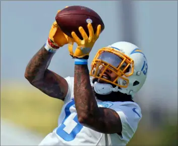  ?? AP Photo/Jae C. Hong ?? In this Aug. 19 file photo, Los Angeles Chargers wide receiver Keenan Allen makes a catch during NFL football camp in Costa Mesa, Calif.