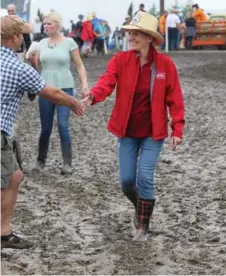  ?? DAVE CHIDLEY/THE CANADIAN PRESS ?? Premier Kathleen Wynne got a warmer welcome at this year’s plowing match than last year’s, perhaps thanks to lower electric bills.