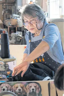  ??  ?? BELOW Masako Wilson, a seamstress, at work.