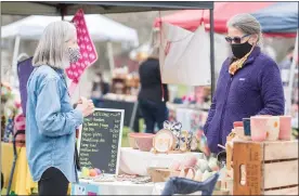  ??  ?? Nearly 30artists and artisans paid $25to rent a space on the cemetery grounds for the fair.