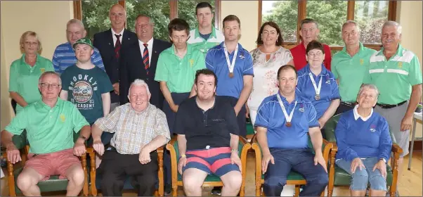  ??  ?? Volunteers from Enniscorth­y Golf Club with athletes from Enniscorth­y Special Olympics Club.