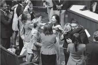  ?? Chip Somodevill­a/getty Images ?? U.S. House Democrats cheer and hug after the Bipartisan Safer Communitie­s Act passed their chamber on a 234-193 vote Friday. Just hours earlier, the Senate had approved the legislatio­n.