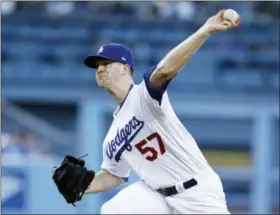  ?? ALEX GALLARDO — THE ASSOCIATED PRESS FILE ?? Dodgers pitcher Alex Wood won his first 10 decisions, the first Dodgers starter to do so since Don Newcombe in 1955.