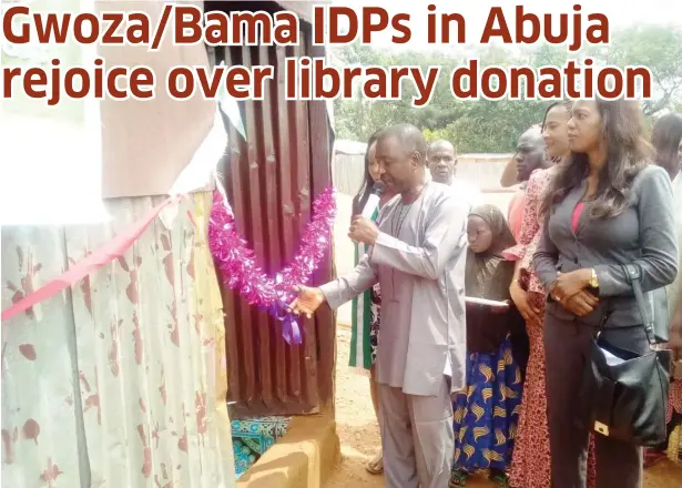  ?? Photos: Terkula Igidi ?? A staff of National Library of Nigeria, Mr. Julian Makeri, commission­s the library which was donated by NEOF to the Gwoza/Bama IDP Camp, Durumi, Abuja yesterday.