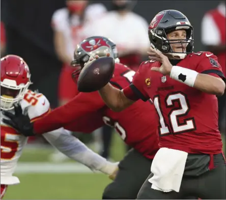  ?? MARK LOMOGLIO - THE ASSOCIATED PRESS ?? In this Sunday, Nov. 29, 2020 file photo, Tampa Bay Buccaneers quarterbac­k Tom Brady (12) throws a pass against the Kansas City Chiefs during the first half of an NFL football game in Tampa, FL.