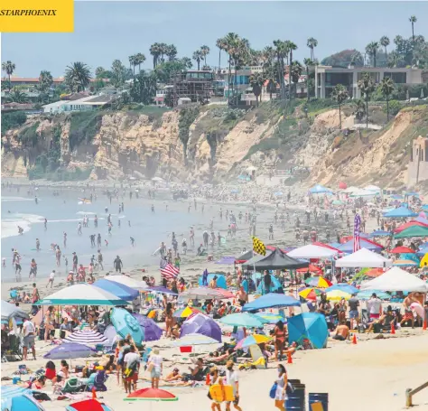  ?? SANDY HUFFAKER / AFP VIA GETTY IMAGES ?? People flock to the beach in San Diego, Calif., on Saturday. Some California cities have defied requests to clamp down on public gatherings.