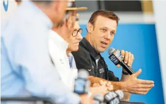  ?? AP PHOTO BY CHUCK BURTON ?? NASCAR driver Matt Kenseth, right, answers a question Wednesday during a news conference in Charlotte, N.C. Kenseth will return to NASCAR this season in a reunion with Roush Fenway Racing, the team that gave him his Cup Series start in 1998. Kenseth...