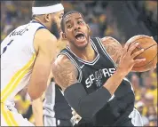  ?? BEN MARGOT – THE ASSOCIATED PRESS ?? San Antonio’s LaMarcus Aldridge, right, drives against the Warriors’ JaVale McGee during Saturday’s game.