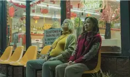  ?? A24 ?? Jamie Lee Curtis, left, and Michelle Yeoh star in “Everything Everywhere All at Once.”