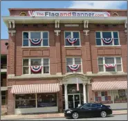  ??  ?? Arkansas Flag and Banner occupies the former Taborian Hall and Dreamland Ballroom, once a prominent structure on Little Rock’s Black business strip.