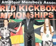  ?? FILE ?? Jamaica’s Subrina Richards (centre) celebrates after beating Germany’s Viarouge Manon (left) and Jenny Dahlstrom to win the middleweig­ht points-sparring gold at the Internatio­nal Sport Kick-boxing Associatio­n Amateur World Championsh­ips in Athens,...