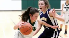  ?? CITIZEN FILE PHOTO ?? PGSS Polars player Julia Kreitz drives hard past Brook Dowswell of the Nechako Valley Viqueens in the junior A girls zone basketball championsh­ips in February. Whether its basketball or business, there’s no path to success without the right team.