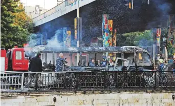  ?? Reuters ?? The bus after the bomb attack in central Damascus. A military source said the bombs were detonated near the Hafez Al Assad bridge. A third bomb in the same area was defused,