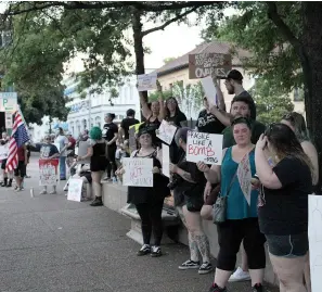  ?? The Sentinel-Record/James Leigh ?? ■ A group of protesters gathers at Hill-Wheatley Plaza Sunday evening to demonstrat­e for abortion rights.