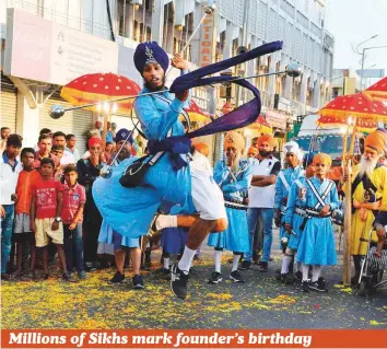  ??  ?? Sikhs demonstrat­e their martial arts skills during a ‘nagar keertan’ (procession) in Secunderab­ad, the twin city of Hyderabad, yesterday, as part of celebratio­ns marking the 549th birth anniversar­y of Sikhism founder Sri Guru Nanak Dev, which was yesterday.