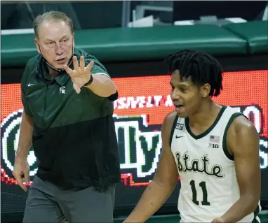  ?? CARLOS OSORIO — THE ASSOCIATED PRESS ?? Michigan State head coach Tom Izzo directs guard A.J. Hoggard during the second half against Rutgers on Jan. 5in East Lansing, Mich.