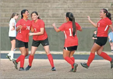  ?? Jeremy Stewart ?? Cedartown’s Nancy Barrientos (14) celebrates with her teammates after scoring a goal against Pickens during last Friday’s Region 7-4A match at Cedartown Memorial Stadium. The Lady Bulldogs blanked the visiting Lady Dragons to get their first region win.