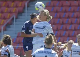  ?? RICK BOWMER — THE ASSOCIATED PRESS ?? North Carolina Courage forward Lynn Williams, left, and Portland Thorns FC midfielder Lindsey Horan vie for a header during the first half of an NWSL Challenge Cup match June 27 at Zions Bank Stadium in Herriman, Utah.